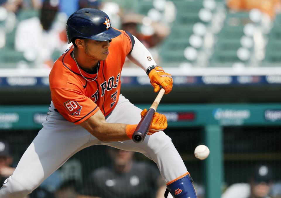 Houston Astros' Jeremy Pena (3) lays down a sacrifice bunt to advances base runners against the Detroit Tigers during the fifth inning of a baseball game Wednesday, Sept. 14, 2022, in Detroit. (AP Photo/Duane Burleson)