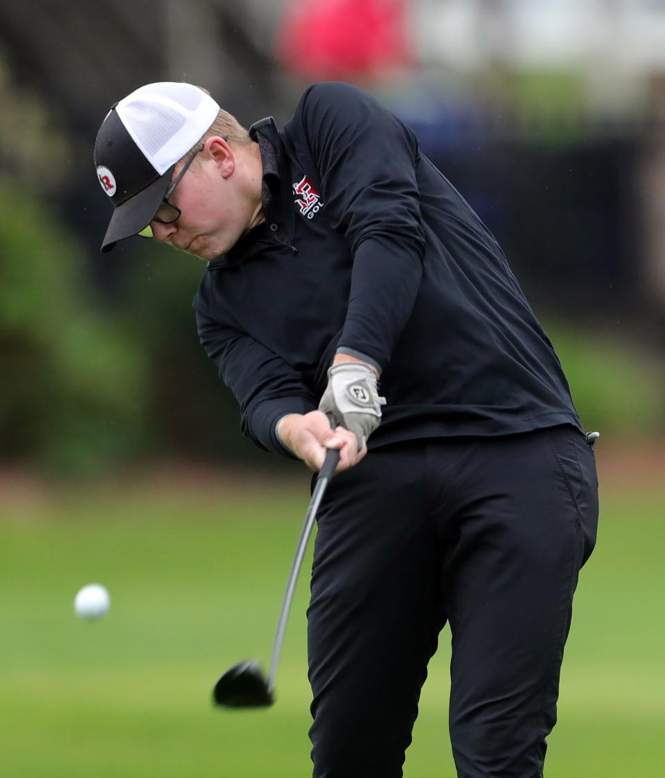 Liam Curtis of Kent Roosevelt takes his shot from the No. 2 tee box during the Suburban League golf tournament at J.E. Good Park Golf Course on Sept. 28 in Akron.