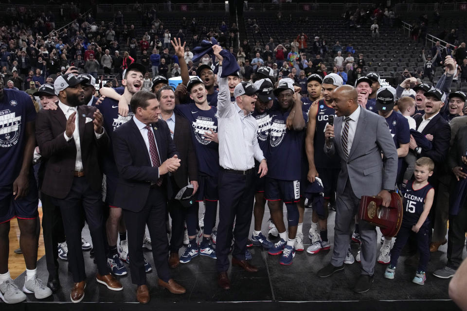UConn head coach Dan Hurley, middle, celebrates with his team after the 82-54 win against Gonzaga of an Elite 8 college basketball game in the West Region final of the NCAA Tournament, Saturday, March 25, 2023, in Las Vegas. (AP Photo/John Locher)