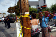 <p>People stand behind police tape near a home that was destroyed by an explosion in the early morning in the Bronx borough of New York on Sept. 27, 2016. (REUTERS/Shannon Stapleton) </p>