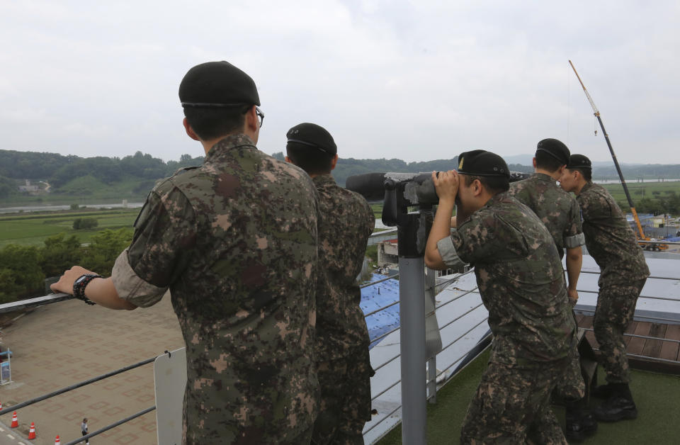 South Korean army soldiers look toward the North's side at the Imjingak Pavilion, near the demilitarized zone of Panmunjom, in Paju, South Korea, Thursday, June 20, 2019. Chinese President Xi Jinping departed Thursday morning for a state visit to North Korea, where he's expected to talk with leader Kim Jong Un about his nuclear program while negotiations have stalled with Washington. (AP Photo/Ahn Young-joon)
