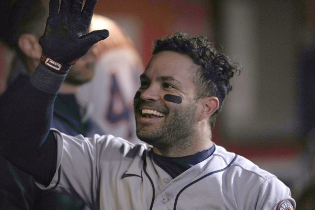 Houston Astros' Jose Altuve celebrates in the dugout with teammates after hitting a solo home run against the San Francisco Giants during the fifth inning of a baseball game Friday, July 30, 2021, in San Francisco. (AP Photo/Tony Avelar)
