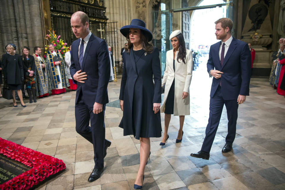 FILE - In this Monday, March 12, 2018 file photo, from left, Britain's Prince William, Kate the Duchess of Cambridge, Meghan Markle and Britain's Prince Harry arrive for the Commonwealth Service at Westminster Abbey. Britain and its royal family are absorbing the tremors from a sensational television interview with Prince Harry and Meghan. The couple said they encountered racist attitudes and a lack of support that drove Meghan to thoughts of suicide. The couple gave a deeply unflattering depiction of life inside the royal household, depicting a cold, uncaring institution that they had to flee to save their lives. Meghan told Oprah Winfrey that at one point “I just didn’t want to be alive anymore.” Meghan, who is biracial, said that when she was pregnant with son Archie, there were “concerns and conversations about how dark his skin might be when he’s born.” (Paul Grover/Pool Photo via AP, FIle)