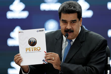 FILE PHOTO: Venezuela's President Nicolas Maduro speaks during the kick-off event for the international trading of Petro, the cryptocurrency developed by the Venezuelan government, in Caracas, Venezuela October 1, 2018. REUTERS/Carlos Garcia Rawlins/File Photo