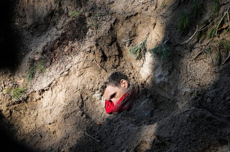 One of four bodies, including the village mayor and her family, is exposed in a mass grave in Motyzhyn close to Kyiv, Ukraine, (Copyright 2023 The Associated Press. All rights reserved.)