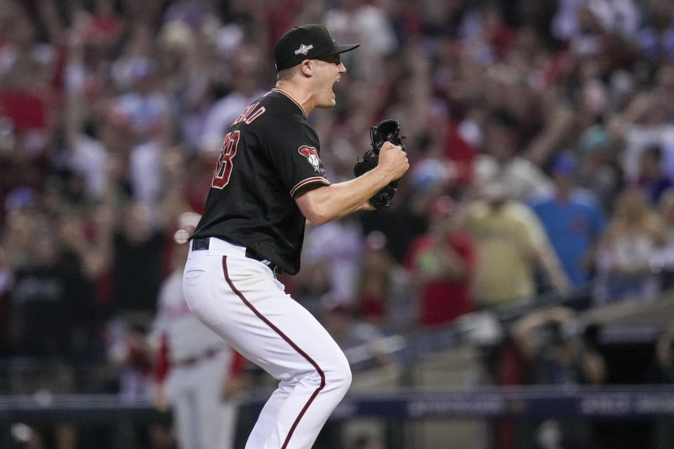 Arizona Diamondbacks relief pitcher Paul Sewald celebrates their win against the Philadelphia Phillies in Game 4 of the baseball NL Championship Series in Phoenix, Friday, Oct. 20, 2023. (AP Photo/Ross D. Franklin)
