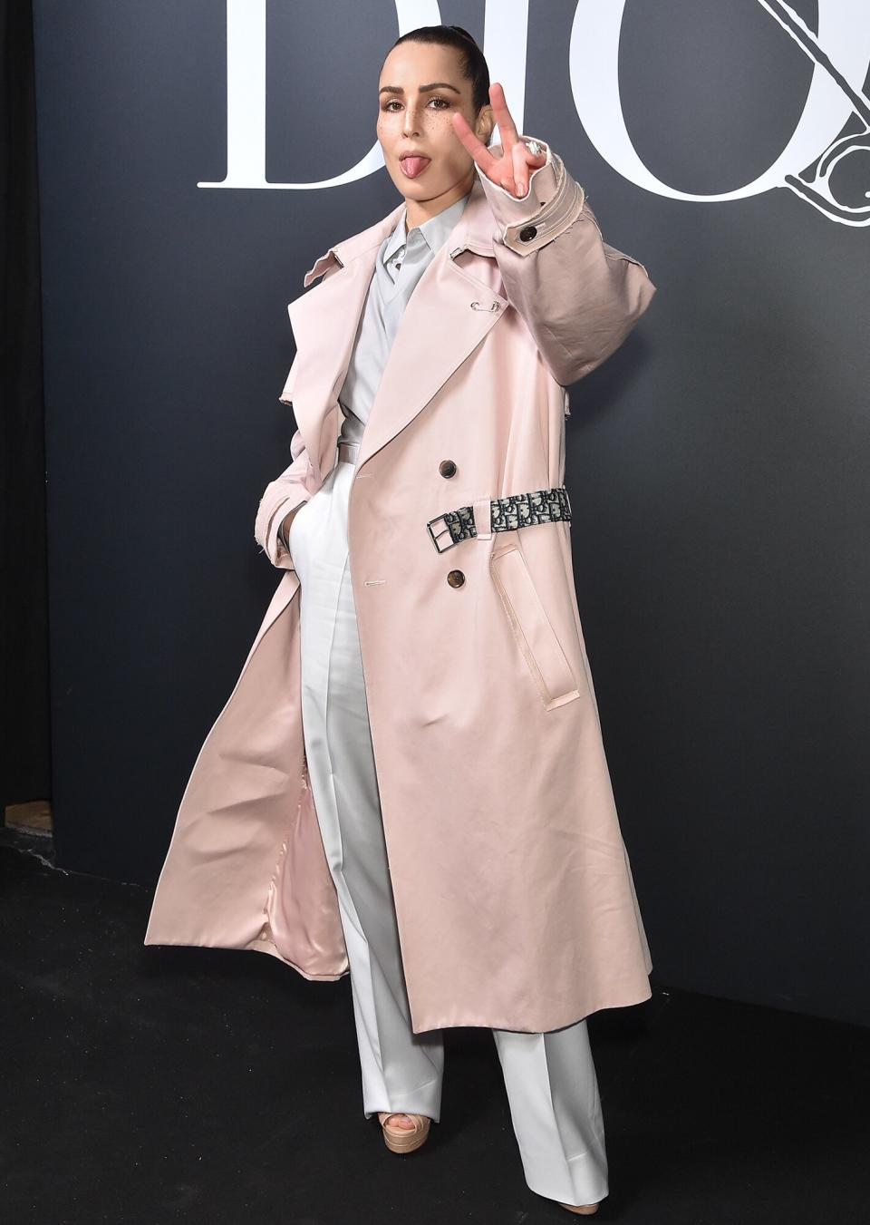 Noomi Rapace goofs off for the cameras at the Dior Homme Menswear Fall/Winter 2020-2021 show during Paris Fashion Week on Friday.