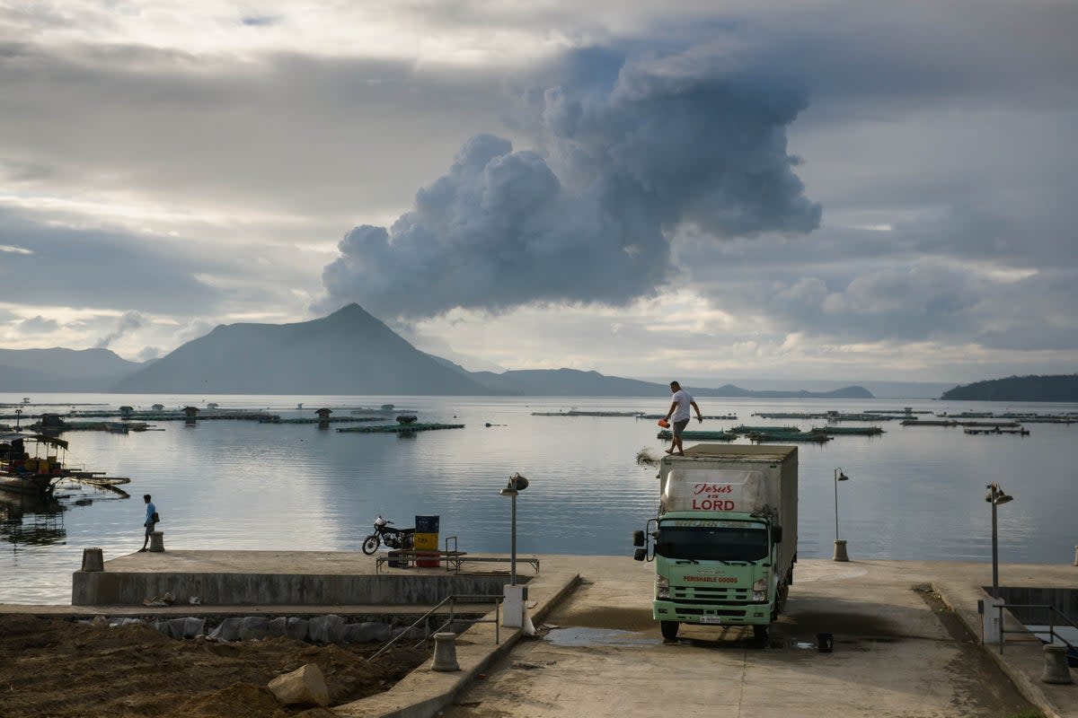 A plume of steam shoots up from Philippines’ Taal Volcano, which saw a devastating eruption on 12 January 2020 (AFP via Getty Images)
