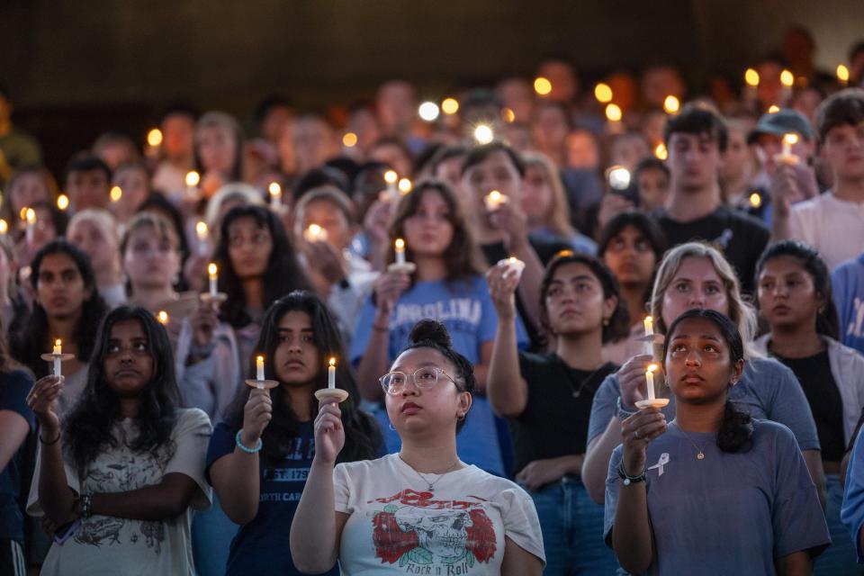 University of North Carolina-Chapel Hill students, faculty and family hold a candlelight vigil, Friday, Aug 30, 2023, in Chapel Hill, N.C., in honor of professor Zijie Yan who was shot and killed on campus on Monday. (Travis Long/The News & Observer via AP)