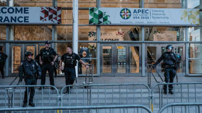 San Francisco police wait outside a building