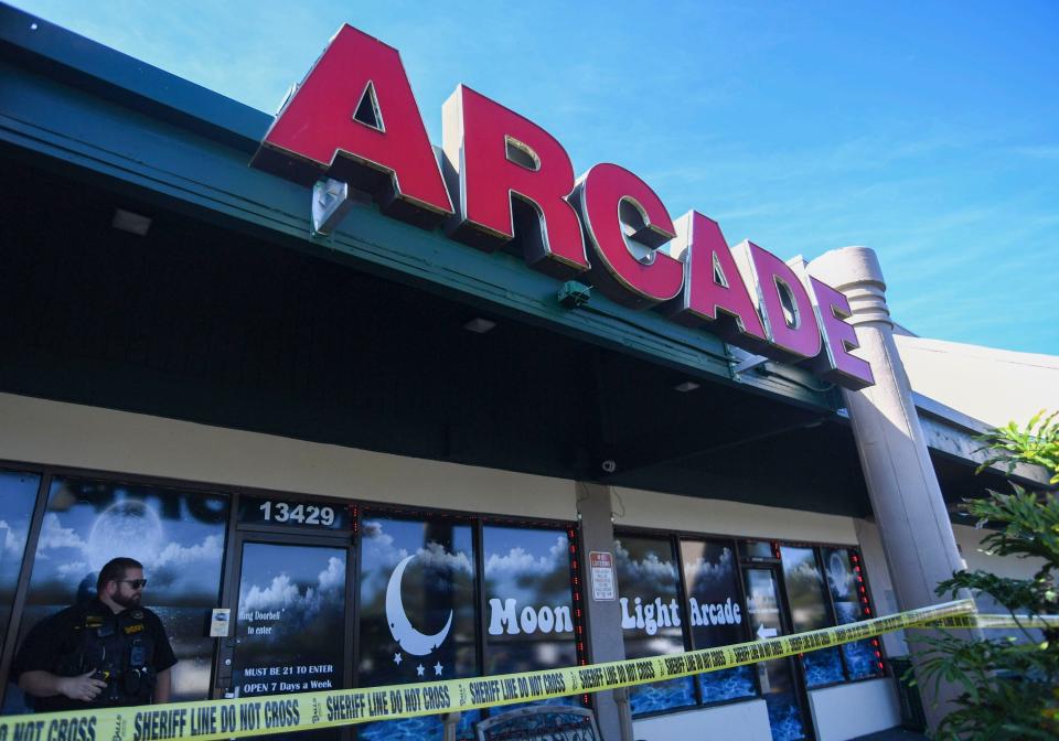Sheriff's officials raid an arcade accused of illicit gambling, Wednesday, Nov. 29, 2023, in Roseland. Moonlight Express arcade, 13429 U. S. 1, in the Riverwalk Shopping Center, was shut down.