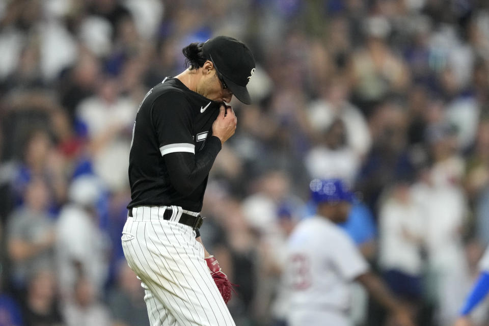 Chicago White Sox relief pitcher Joe Kelly reacts after walking Chicago Cubs' Mike Tauchman with the bases loaded during the fifth inning of a baseball game, Wednesday, July 26, 2023, in Chicago. (AP Photo/Charles Rex Arbogast)