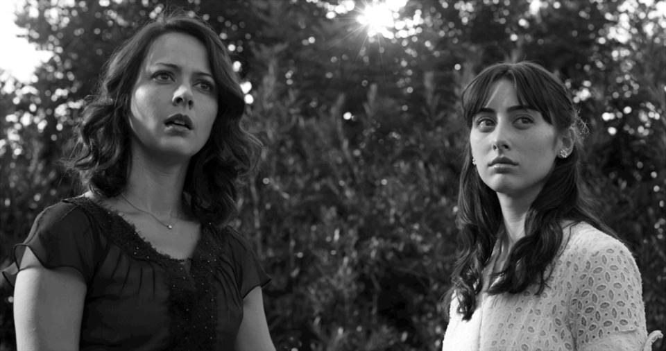 This film image released by Roadside Attractions shows Amy Acker, left, and Jillian Morgesen in a scene from "Much Ado About Nothing." As an iconoclastic group, modern black-and-white movies stand out for their classical photography and their willful connection to an earlier period of filmmaking. (AP Photo/Roadside Attractions, Elsa Guillet-Chapuis)