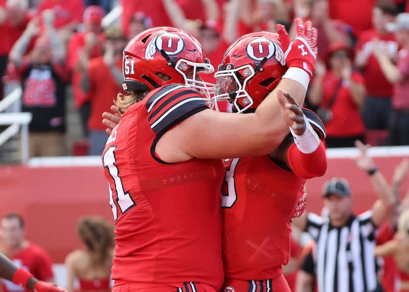 Utah Utes offensive lineman Keaton Bills (51) celebrates with Utah Utes quarterback Nate Johnson after touchdown against the Florida Gators in Salt Lake City on Thursday, Aug. 31, 2023. | Jeffrey D. Allred, Deseret News