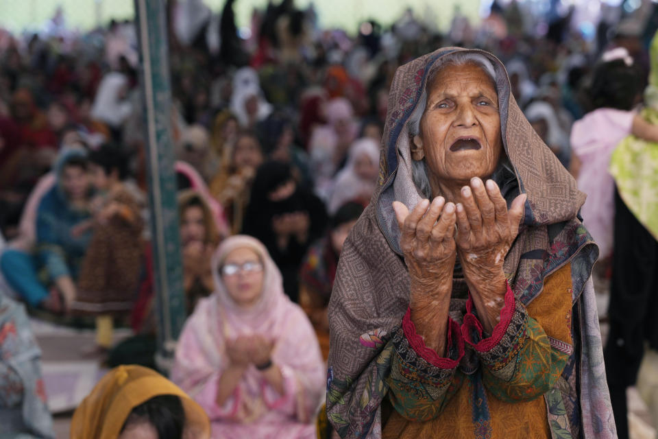 Muslim women perform an Eid al-Fitr prayer, marking the end of the fasting month of Ramadan, at historical Badshahi mosque in Lahore, Pakistan, Wednesday, April, 10, 2024. (AP Photo/K.M. Chaudary)