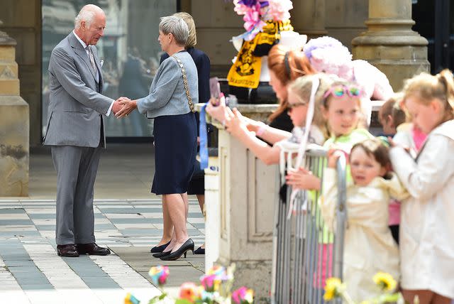 <p>PETER POWELL/POOL/AFP via Getty</p> King Charles being welcomed to Southport on Aug. 20, 2024.