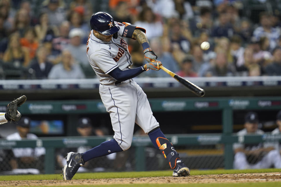 Houston Astros' Carlos Correa (1) hits a two-run single against the Detroit Tigers in the fifth inning of a baseball game in Detroit, Thursday, June 24, 2021. (AP Photo/Paul Sancya)