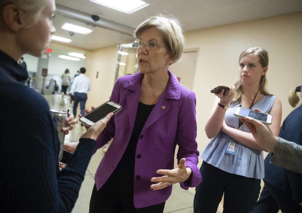 Sen. Elizabeth Warren, D-Mass., responds to reporters' questions on Supreme Court nominee Brett Kavanaugh amid scrutiny of a woman's claim he sexually assaulted her at a party when they were in high school, on Capitol Hill in Washington, Tuesday, Sept. 18, 2018. (AP Photo/J. Scott Applewhite)