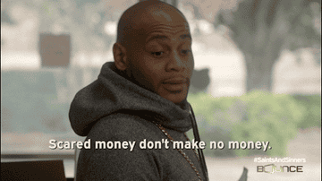 A man looks surprised in a gif with text "Scared money don't make no money."