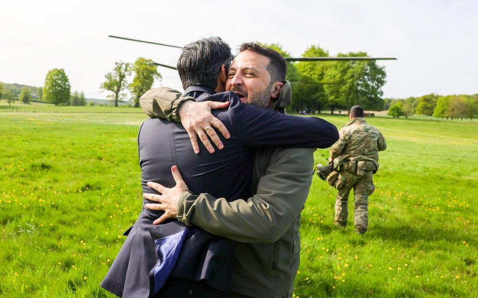 Rishi Sunak and Volodymyr Zelensky embrace as Zelensky lands near the Prime Minister's country residence Chequers in Buckinghamshire