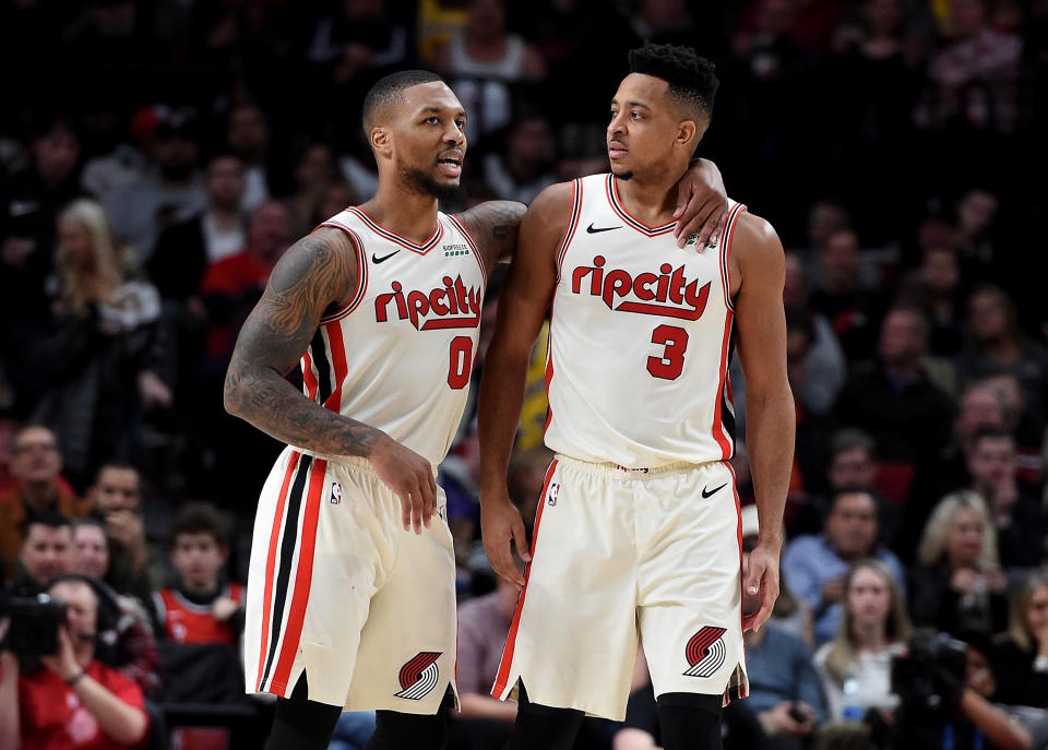 PORTLAND, OREGON - DECEMBER 06: Damian Lillard #0 of the Portland Trail Blazers tries to speak with CJ McCollum #3 after McCollum drew a technical foul during the second half of the game against the Los Angeles Lakers at Moda Center on December 06, 2019 in Portland, Oregon. The Lakers won 136-113. NOTE TO USER: User expressly acknowledges and agrees that, by downloading and or using this photograph, User is consenting to the terms and conditions of the Getty Images License Agreement. (Photo by Steve Dykes/Getty Images)