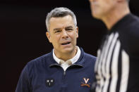 Virginia head coach Tony Bennett complains to a referee during the first half of an NCAA college basketball game against Florida in Charlottesville, Va., Saturday, Dec. 3, 2022. (AP Photo/Mike Kropf)