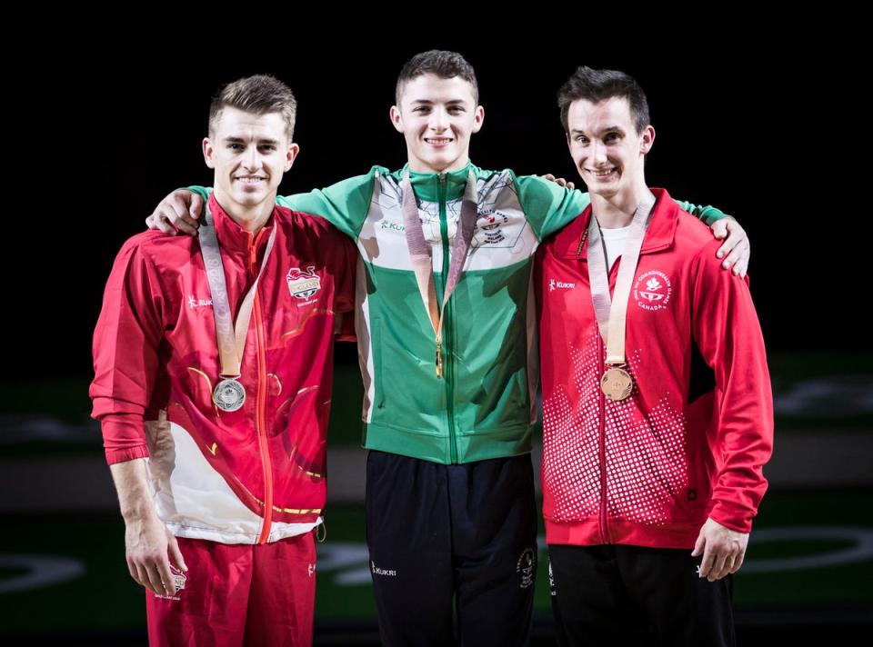 Rhys McClenaghan (centre) shocked Max Whitlock on the Gold Coast (Danny Lawson/PA) (PA Archive)