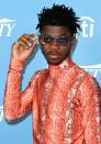 <p>He had to show out at this "Hitmakers brunch" event looking like the hitmaker he is. Lil Nas X is no stranger to glasses on the red carpet, but this orange leopard-print turtle neck was a fun departure from the cowboy aesthetic he was devoted to in 2019.</p>