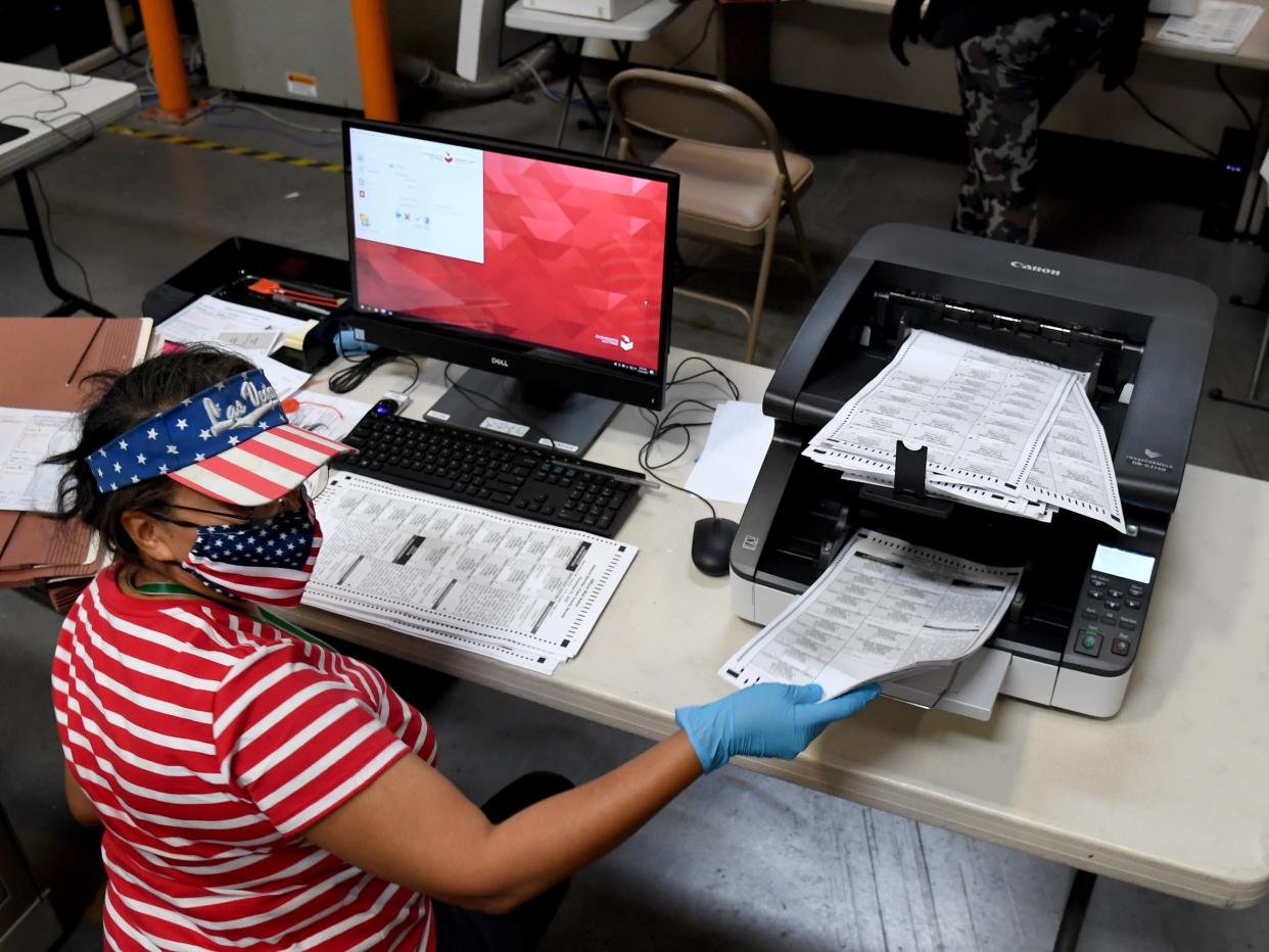 <p>A Clark County election worker scans mail ballots at the Clark County Election Department on in North Las Vegas, Nevada</p> (Getty)