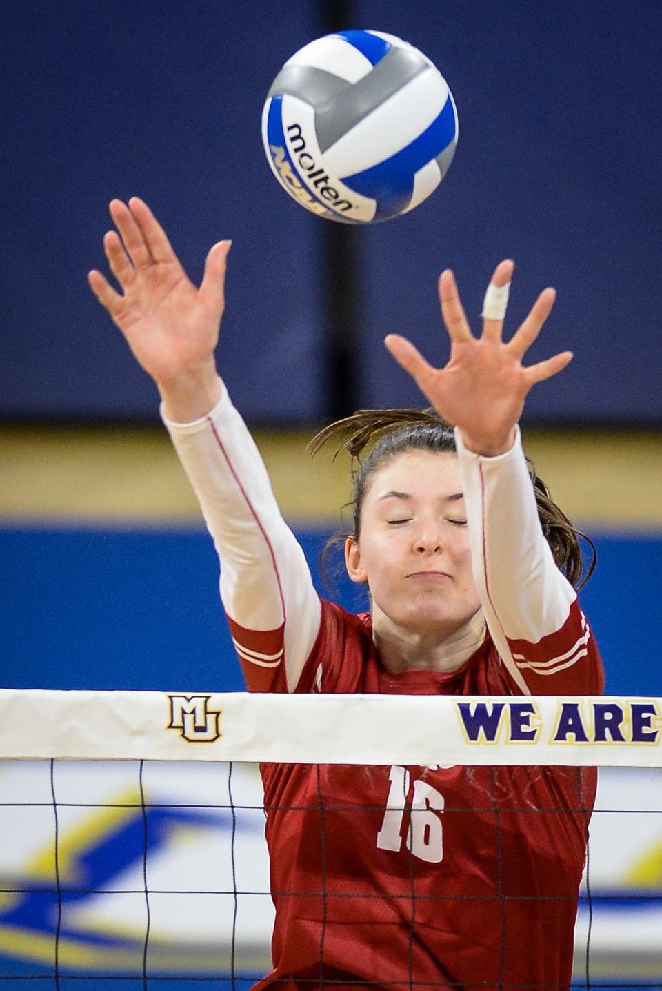 Wisconsin middle blocker Dana Rettke, one of the Badgers' five fifth-year seniors,  was named the American Volleyball Coaches Association national player of the year Friday.