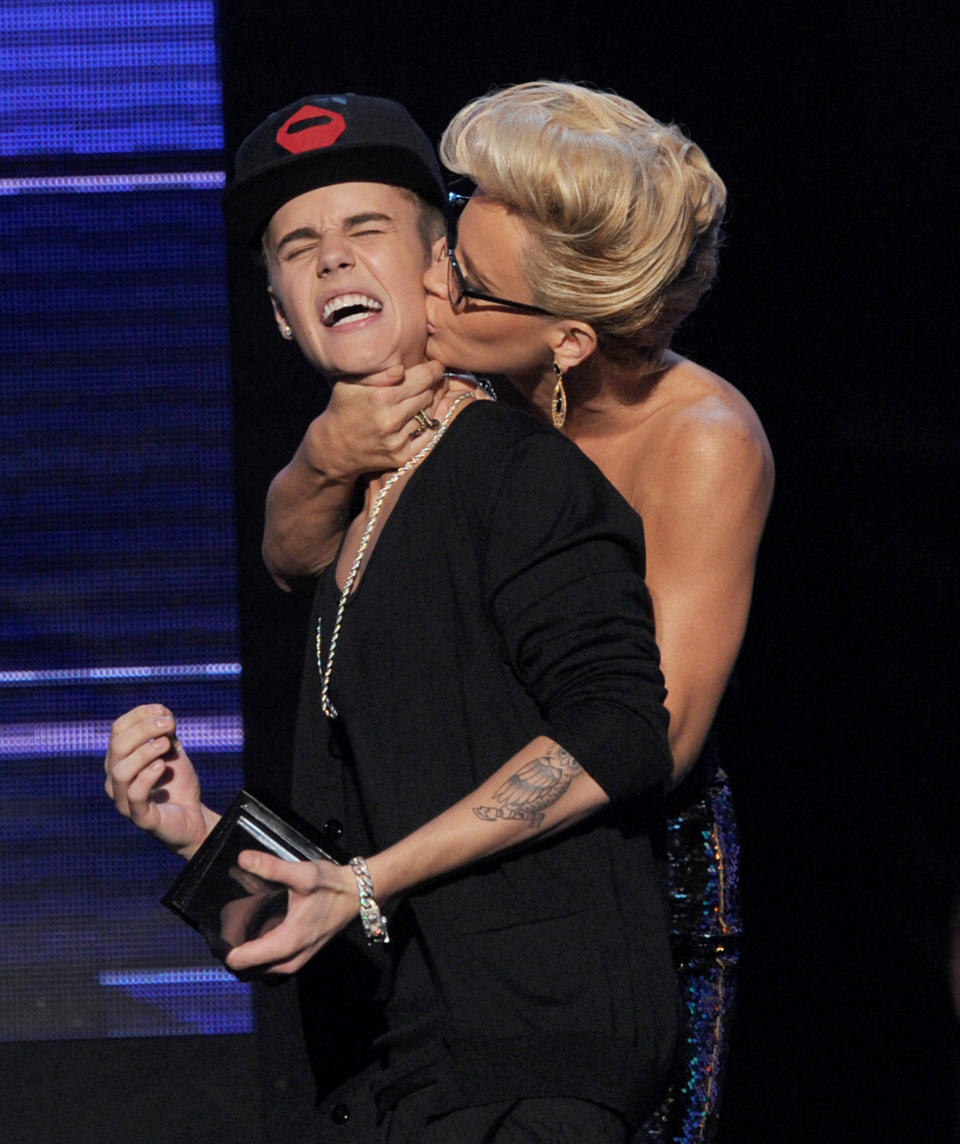 Justin Bieber is forcefully kissed by Jenny McCarthy at the 40th American Music Awards