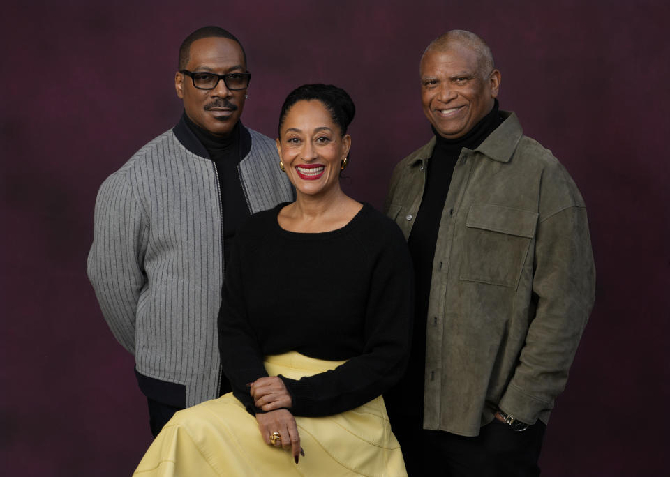 Eddie Murphy, left, and Tracee Ellis Ross, center, cast members in "Candy Cane Lane," and the film's director Reginald Hudlin pose together at the Four Seasons Hotel, Wednesday, Nov. 29, 2023, in Los Angeles. (AP Photo/Chris Pizzello)