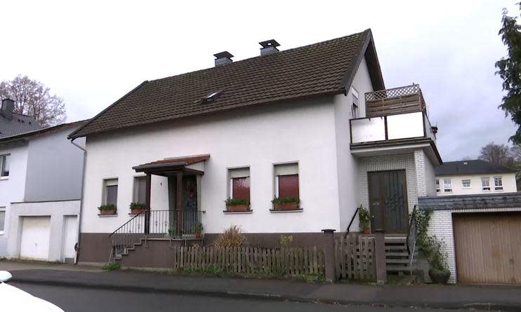 A house in the western German town of Attendorn, where a girl was rescued after allegedly being held captive by her mother and grandparents for most of her life, is seen on November 7, 2022.  / Credit: Reuters