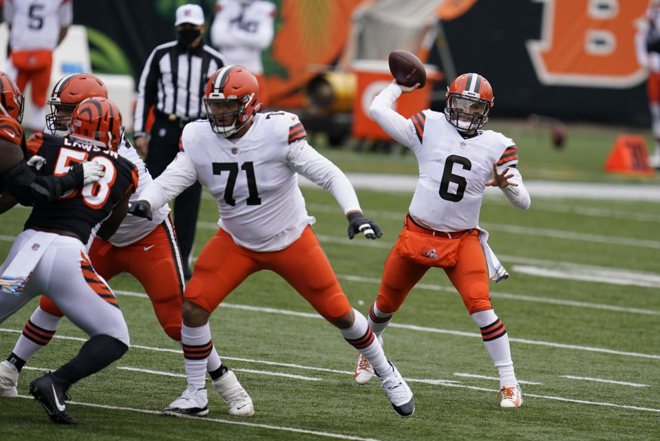 Cleveland Browns quarterback Baker Mayfield (6) throws during the first half of an NFL football game against the Cincinnati Bengals, Sunday, Oct. 25, 2020, in Cincinnati. (AP Photo/Michael Conroy)
