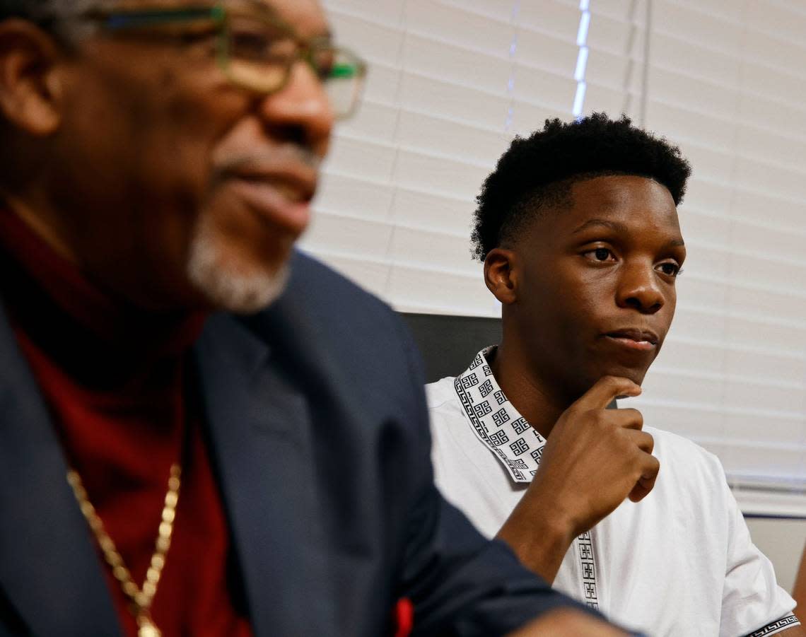 Youth Advocate Programs participant Jeremy, 16, right, and his advocate, VJ Smith, left, listen to criminal defense attorney MarQuetta A. Clayton during a meeting in April. The program provides counseling, mentorship and training as an alternative to detention to children in the juvenile justice system.