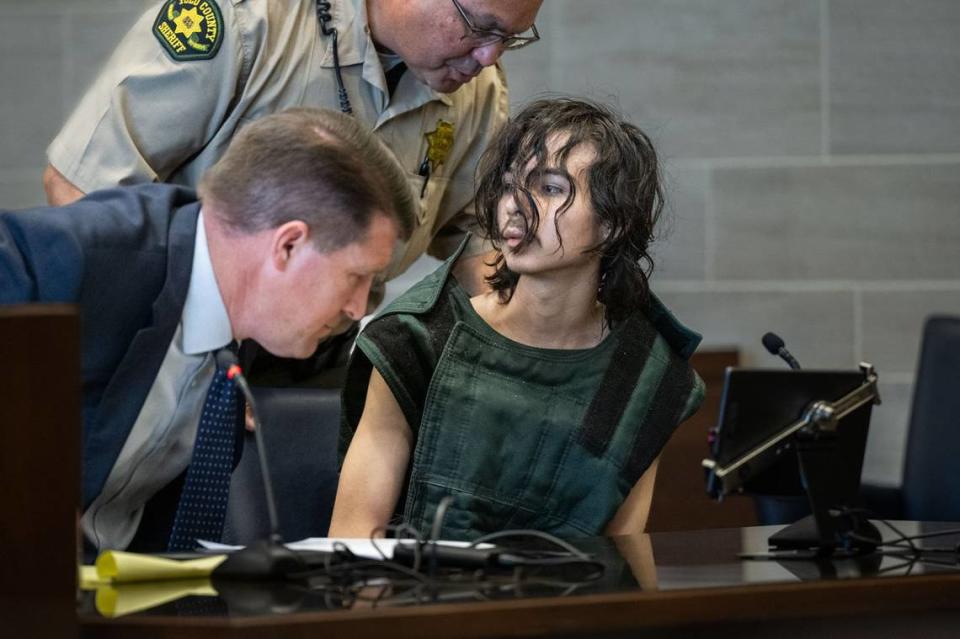 Carlos Reales Dominguez, who is charged with fatally stabbing two men in Davis and wounding a third victim, prepares to leave the courtroom after appearing before Yolo Superior Court Judge Samuel McAdam on Tuesday, June 6, 2023, with court-appointed public defender Dan Hutchinson. Hector Amezcua/hamezcua@sacbee.com