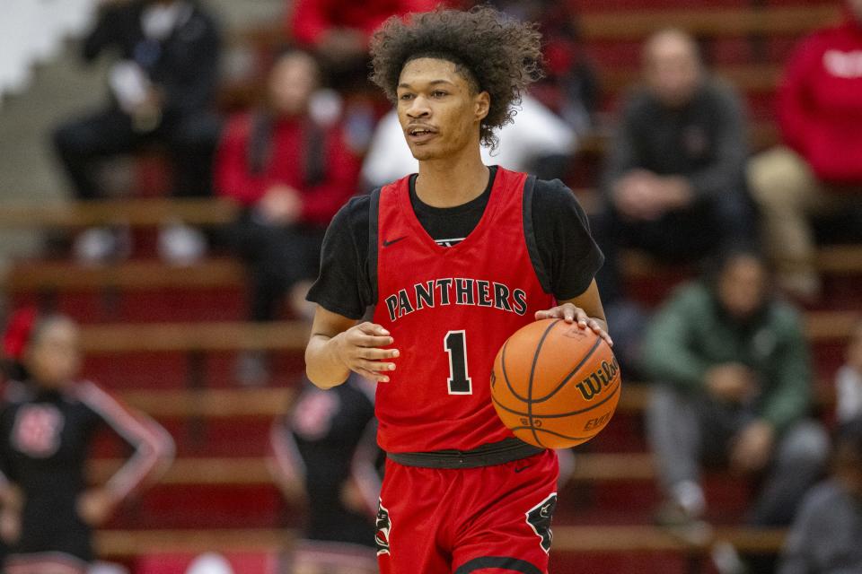 North Central High School senior Tim Williams, Jr. (1) brings the ball up court during the first half of a Boysâ€™ Marion County Basketball Tournament semi-final game against Lawrence North High School, Friday, Jan. 12, 2024, at Southport High School.