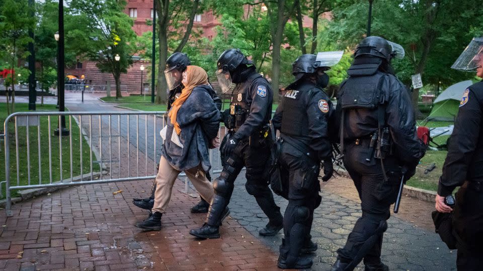 Police detain a protester on the University of Pennsylvania campus in Philadelphia on Friday. - Jessica Griffin/The Philadelphia Inquirer/AP