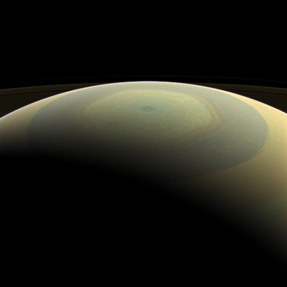 The globe of Saturn, seen here in natural color, is reminiscent of a holiday ornament in this wide-angle view from NASA's Cassini spacecraft. The characteristic hexagonal shape of Saturn's northern jet stream, somewhat yellow here, is visible.