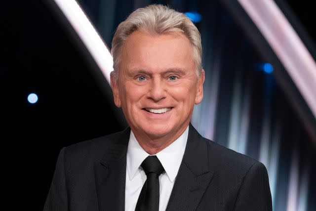 <p>Eric McCandless/ABC via Getty</p> Pat Sajak says goodbye as host of "Wheel of Fortune."