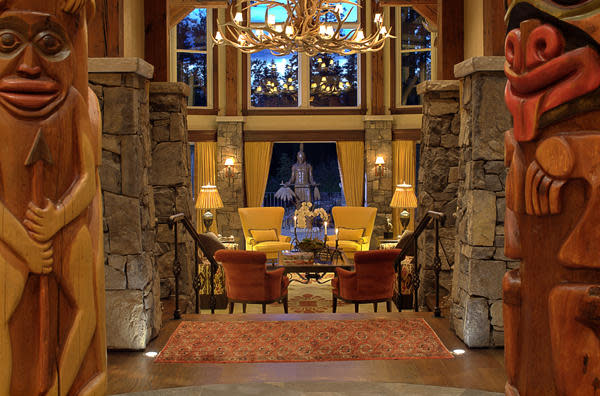 <p>This 10,000-square-foot home is an architectural dream, with totem poles flanking the great room. (Listing via <a rel="nofollow noopener" href="http://calgary.evcanada.com/en/listing/cms/123cairnslanding/" target="_blank" data-ylk="slk:Engel & Volkers;elm:context_link;itc:0;sec:content-canvas" class="link ">Engel & Volkers</a>) </p>