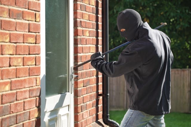 burglar breaking into a house...