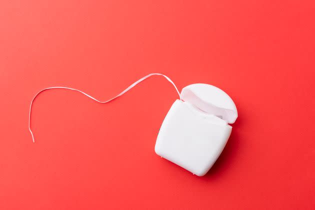 If you're not flossing enough or are flossing improperly, it may contribute to a handful of dental issues. (Photo: HUIZENG HU via Getty Images)