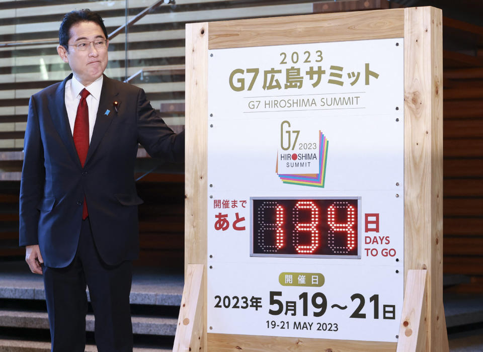 Japan's Prime Minister Fumio Kishida stands next to the G7 Hiroshima Summit countdown board during a ceremony at the prime minister's office on in Tokyo on January 5, 2023. - Japan OUT (Photo by JIJI Press / AFP) / Japan OUT (Photo by STR/JIJI Press/AFP via Getty Images)