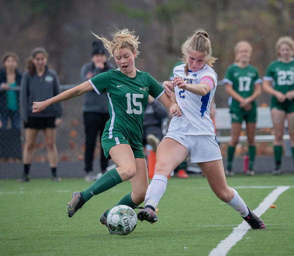 Rice's Raven McCray-Fay, left, battles for possession during the 2022 Division II girls soccer championship game.