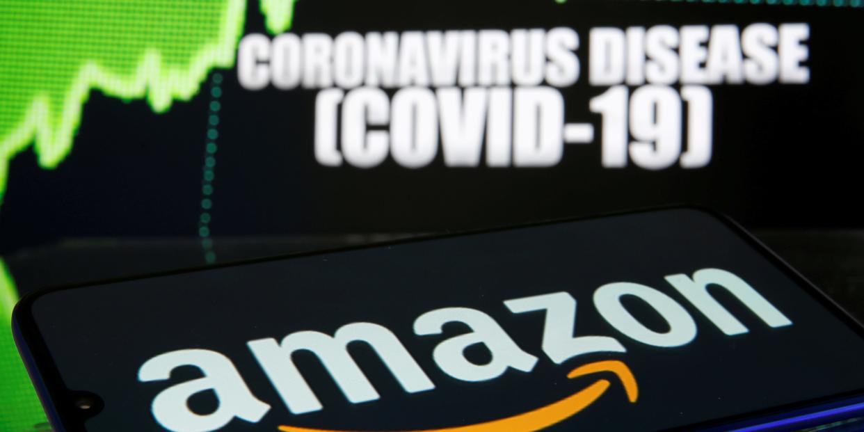 FILE PHOTO: Amazon logo is seen in front of diplayed coronavirus disease (COVID-19) in this illustration taken March 19, 2020. REUTERS/Dado Ruvic/Illustration/File Photo