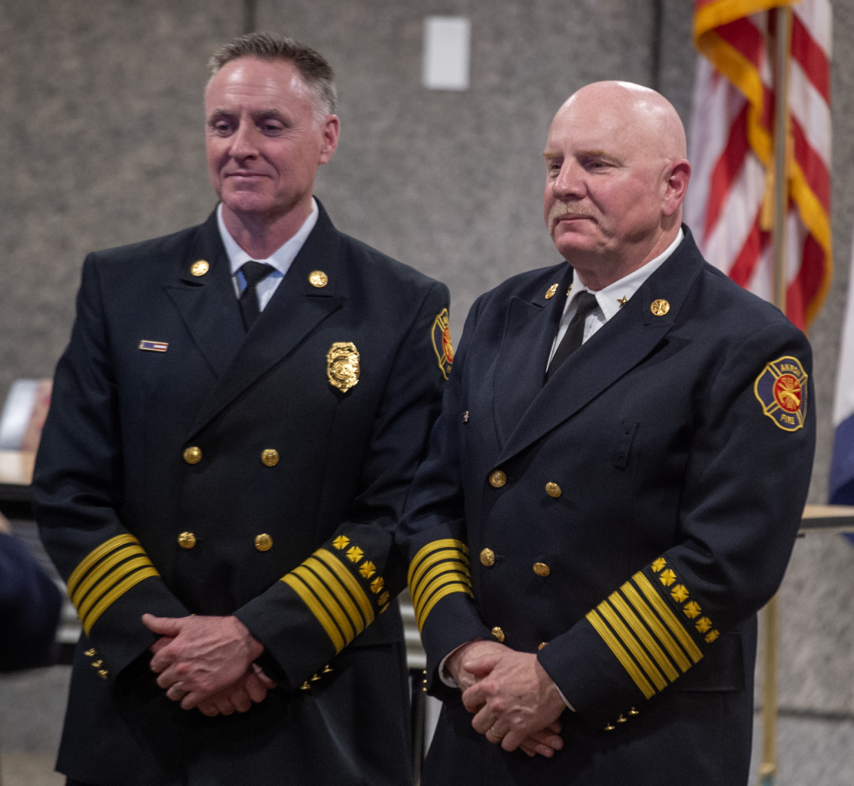 Akron Deputy Fire Chief Steven Kaut, left, stands with Fire Chief Joseph Natko Monday during a pres conference. Natko will officially retire on March 22 before taking on the new assistant to the mayor for emergency management position. Kaut will then serve as acting chief.