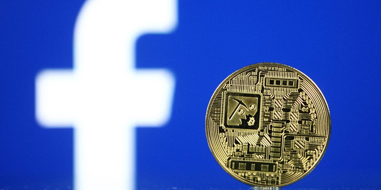 Facebook logo and a cryptocurrency coin are pictured in Kyiv on 29 July, 2021.