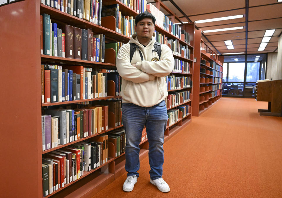 Jesus Noyola, a sophomore attending Rensselaer Polytechnic Institute, poses for a portrait in the Folsom Library, Tuesday, Feb. 13, 2024, in Troy, N.Y. A later-than-expected rollout of a revised Free Application for Federal Student Aid, or FASFA, that schools use to compute financial aid, is resulting in students and their parents putting off college decisions. Noyola said he hasn’t been able to submit his FAFSA because of an error in the parent portion of the application. “It’s disappointing and so stressful since all these issues are taking forever to be resolved,” said Noyola, who receives grants and work-study to fund his education. (AP Photo/Hans Pennink)