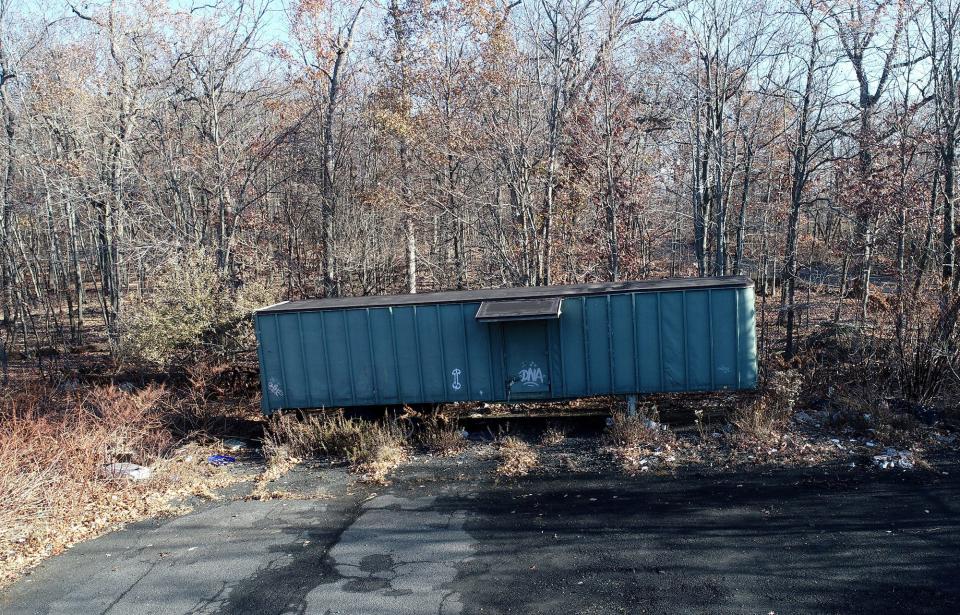 A trailer sits in front of the area where alleged convicted serial killer Khalil Wheeler-Weaver dumped the body of victim Sarah Butler at Eagle Rock Reservation in Essex County, NJ.